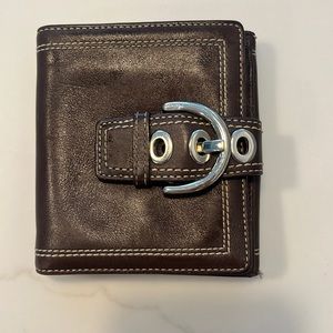 Coach brown leather wallet with silver buckle snap closure